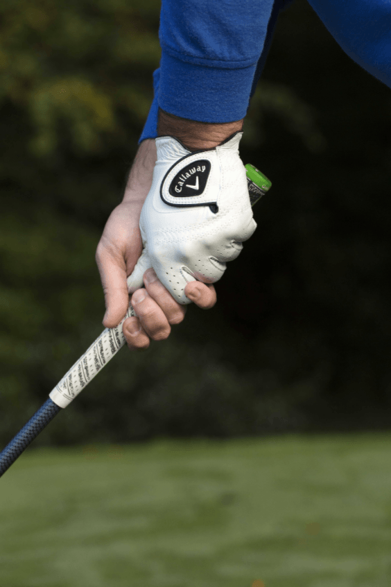 A lad wearing Callaway glove is holding the golf club at Mount Juliet