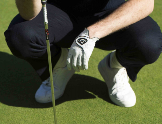 A lad wearing Callaway glove and holding the golf club at Mount Juliet